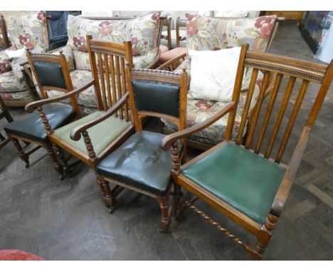 A pair of oak bobbin twist frame carver chairs and a pair of oak dining chairs with upholstered seats and backs 