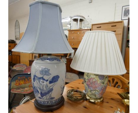 An oriental style blue and white vase style table lamp with shade and a similar floral lamp with shade 