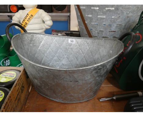 An oval galvanized finished planter 
