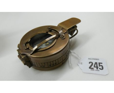 A small hand held brass marching compass
