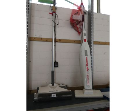 A GTech cordless upright vacuum cleaner and a Bissell magic electric broom 