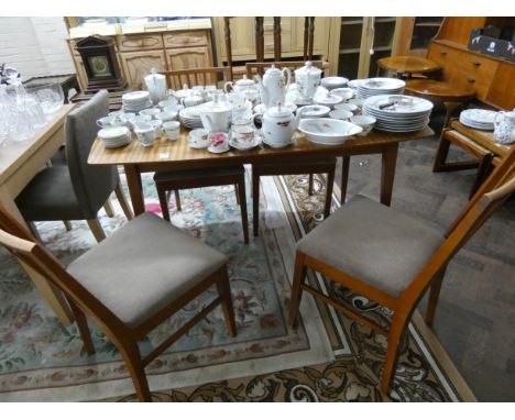 Vanson Danish teak extending dining table with fold away centre leaf and four matching stick back matching chairs 