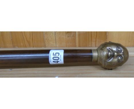 A four faced Buddha walking stick 