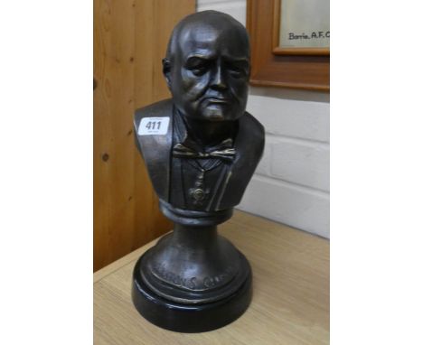 A bronze effect iron bust of Winston Churchill 