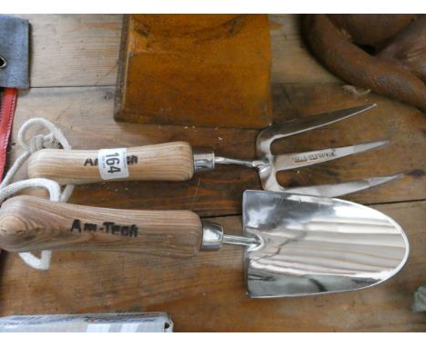 A stainless steel hand trowel and fork 