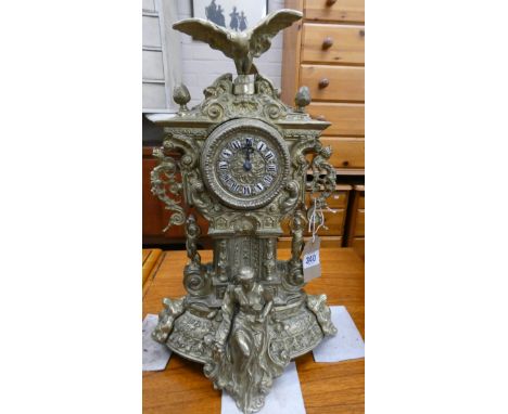 A French style mantel clock in decorative brass figure and bird mounted case 