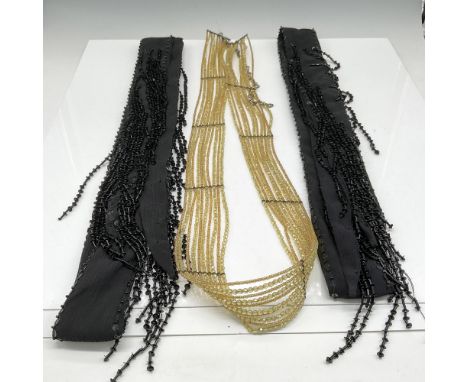 Lot includes 2 black fabric beaded sash belts 68" and yellow beaded belt with hook closure 38". No tags. Issued: 20th century