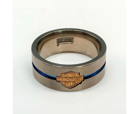 Satin titanium band with a gold washed sterling silver Harley Davidson logo and thin blue channel stripe around the middle. T