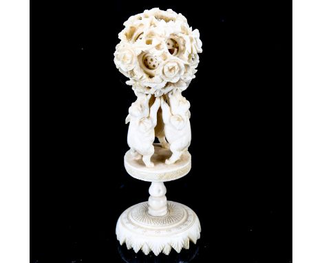 A Chinese ivory puzzle ball on elephant design stand, late 19th century, height 13cmAt least one of the internal balls has be