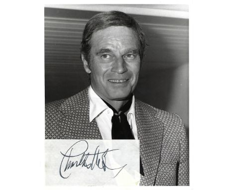 Charlton Heston Signed sticker on photo print black and white 10 x 8 inch. Condition report out of 10, 7. Minor creases to wh