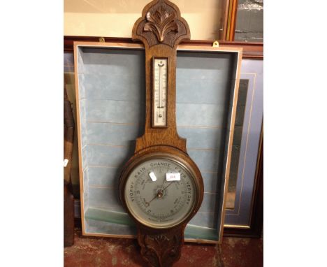 CARVED OAK ANEROID BAROMETER