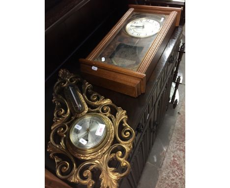 OBLONG WALL CLOCK AND ORNATE BAROMETER
