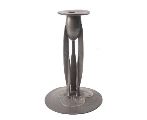 Archibald Knox for Liberty & Co., a Tudric pewter candlestick, early 20th century; with a tulip form socket above three twist