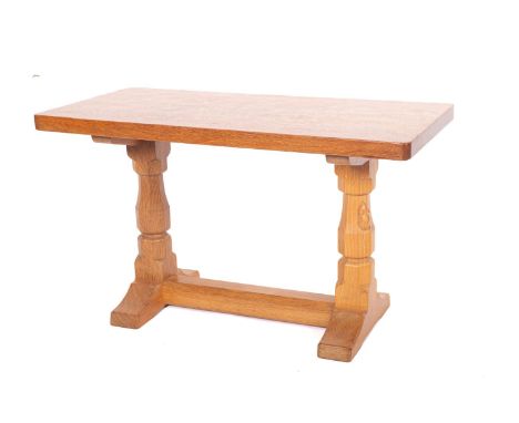 Workshop of Robert 'Mouseman' Thompson. An adzed oak side table, the rectangular top raised on  baluster turned column suppor