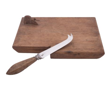 Probably Ben Oxley 'Mouseman' of Windsor, a carved oak cheeseboard, 20th century; of rectangular form; incorporating a slot f