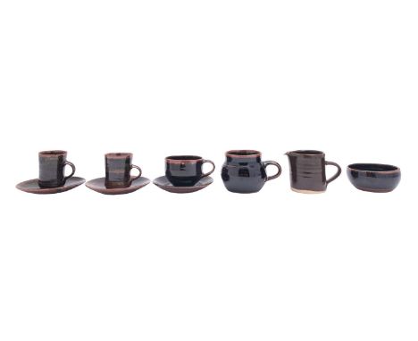A group of Winchcombe and other stoneware, comprising two coffee cups and saucers, a tea cup and saucer, mug, sugar bowl and 