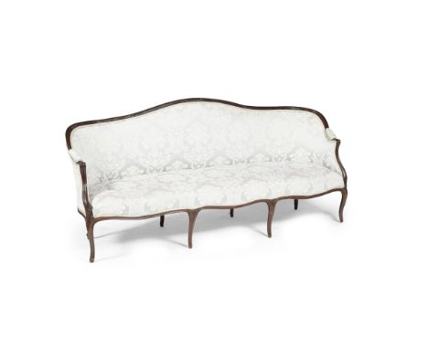 GEORGE III MAHOGANY FRAME SOFA  18TH CENTURY   the serpentine back rail carved with scrolls and leaf trails, above sloping pa