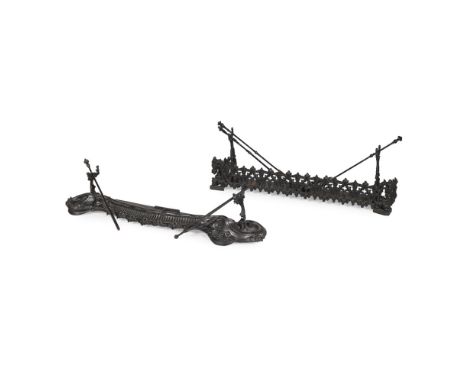 TWO CAST IRON FENDERS AND ACCESSORIES  19TH CENTURY   the first in the Gothic taste with a pierced front panel,133cm wide, 24