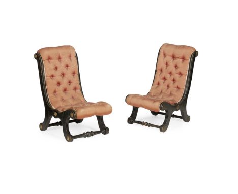 MATCHED PAIR OF REGENCY EBONISED AND PARCEL GILT SLIPPER CHAIRS  EARLY 19TH CENTURY   covered in button upholstered salmon pi