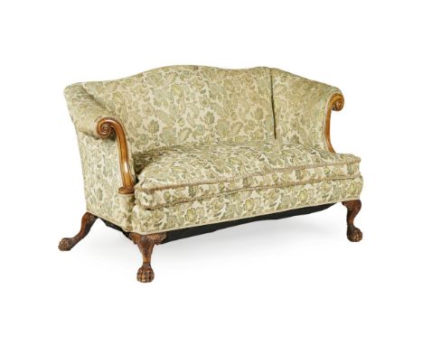 GEORGE II STYLE CARVED WALNUT SOFA, BY MAPLE & CO.  EARLY 20TH CENTURY   the arched back above a loose cushion seat flanked b