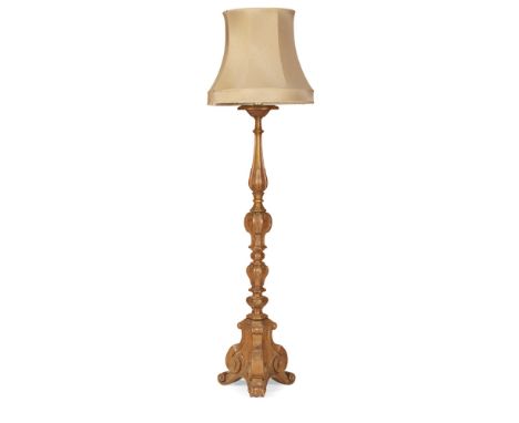 CONTINENTAL PINE TORCHÉRE  19TH CENTURY   in the Renaissance style, the triform column carved with palmettes, scrolled bracke