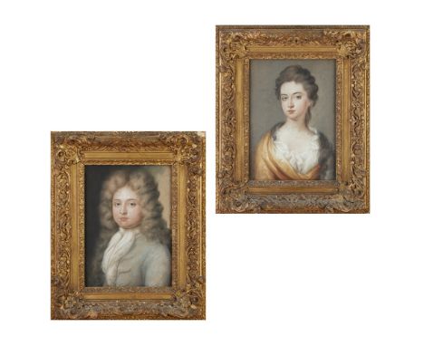 ENGLISH SCHOOL, 18TH CENTURY  PAIR OF PASTEL PORTRAITS   the gentleman with a powdered wig and light blue coat; the lady with