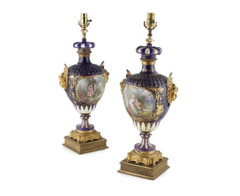PAIR OF SÈVRES STYLE GILT METAL MOUNTED PORCELAIN VASES  19TH CENTURY   the lobed tops on baluster bodies painted with reserv