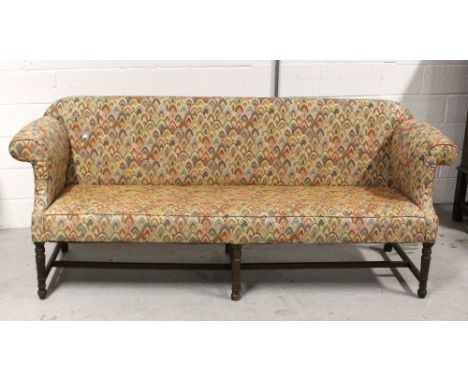 An Edwardian four-seat sofa, low back to scrolling arms on turned supports and cross-stretchers, length 210cm. CONDITION REPO