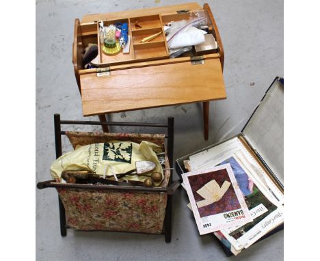 A quantity of sewing equipment, various textiles and knitting guides.