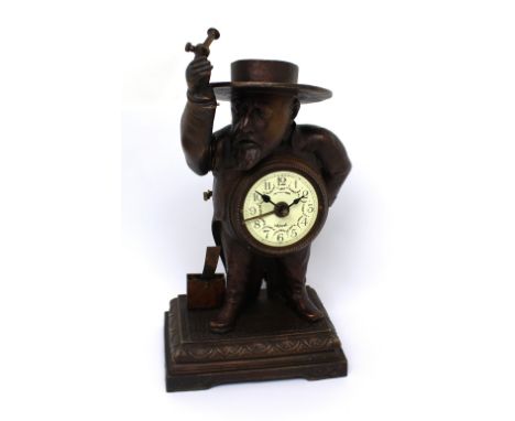 A French automaton clock striker/lighter in the form of an elderly bearded gentleman, the enamelled dial set with floral desi