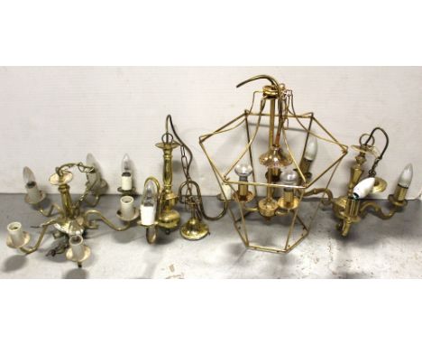 A pair of brass three-branch ceiling candelabra, a non-matching five-branch candelabra and a brass lantern-style ceiling ligh