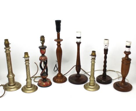 Nine vintage turned wooden table lamps, other ornamental lamps and a metal desk lamp.