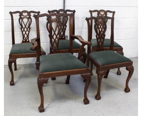 A set of five (4+1) Chippendale-style walnut dining chairs with knee carved cabriole front supports, to ball and claw feet (5