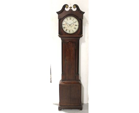 A late 18th/early 19th century oak and mahogany cross-banded longcase clock, the broken swan neck pediment above circular pai