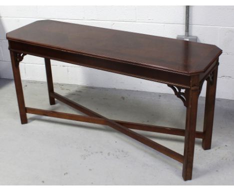 A contemporary mahogany hall table in the Oriental style, to bracket and block supports and cross-stretcher, length 134cm.