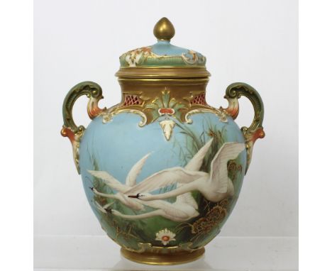 Royal Worcester; a fine twin-handled ovoid vase with cover, painted with swans, signed C Baldwyn, with green mark and numbere