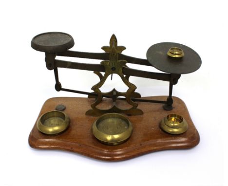 A set of 'Rev JHS' postal scales and weights.