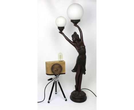 Two Art Deco style table lamps; one in the form of a camera and a large figural lamp in the form of a partially-clad dancer h