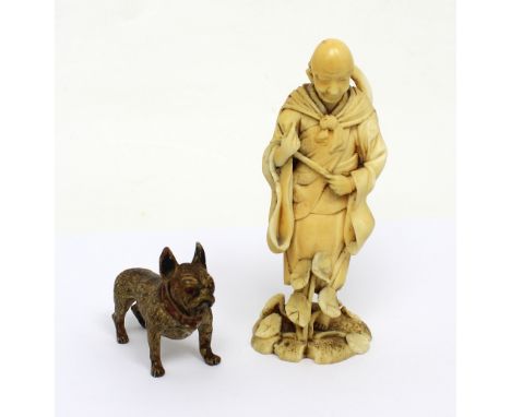 A Japanese Meiji period carved ivory okimono depicting a robed gentleman among lotus flowers (af), height 10cm and a bronze m