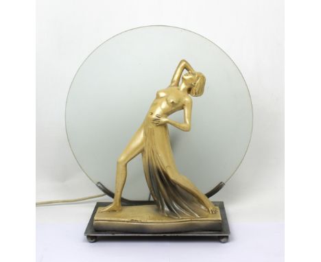 An Art Deco style figural lamp modelled as a naked female, with circular shade, height 37cm.