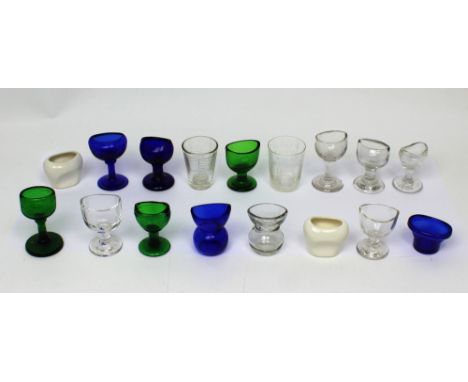 Fifteen 19th and early 20th century eye baths to include blue and green glass and ceramic examples and two medicinal measures