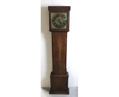 An early 19th century oak and walnut cased eight-day longcase clock of small proportions, the brass dial set with Roman numer