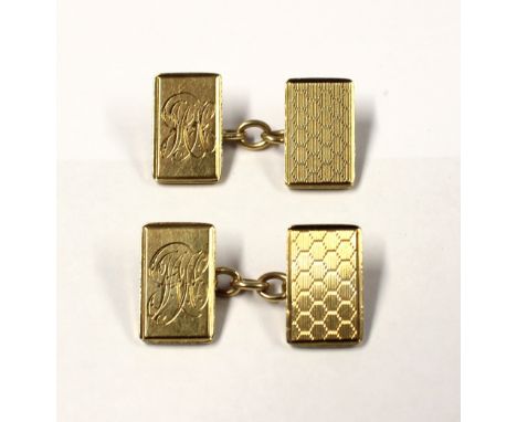 A pair of 9ct gold engine-turned cufflinks with engraved initials to one side, approx 10.2g.