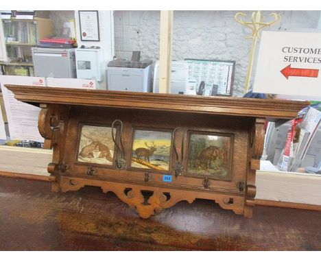 An early 20th century oak wall hanging coat rack, 15 h x 38 w