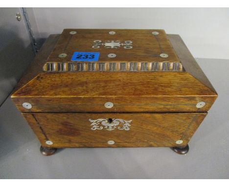 A late Victorian mother of pearl inlaid rosewood work box, the chamfered lid enclosing a tray interior, on button feet, 5 1/2