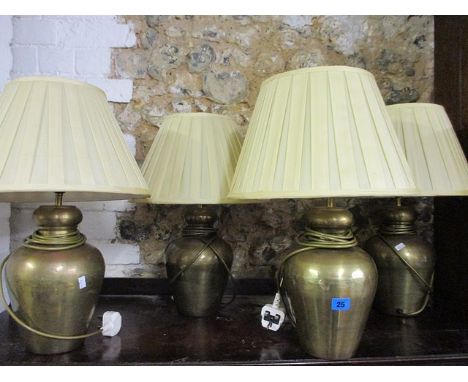 Four Eastern inspired brass table lamps, a pair of barley twist mahogany effect and metal table lamps, an Oriental style tabl