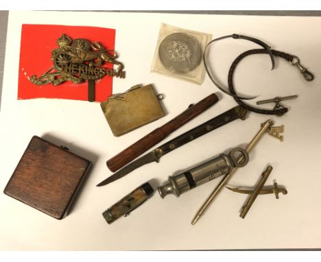 Collection of miscellaneous collectables to include an Artillery &amp; Kings own cap badges, bakerlite pen, whistle, compass 