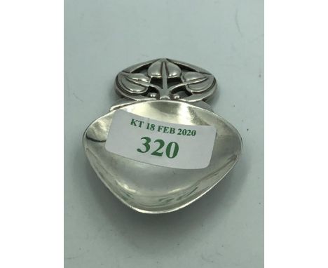 Modern designer silver caddy spoon with stylized leaf handle, maker WW Birmingham 1987 