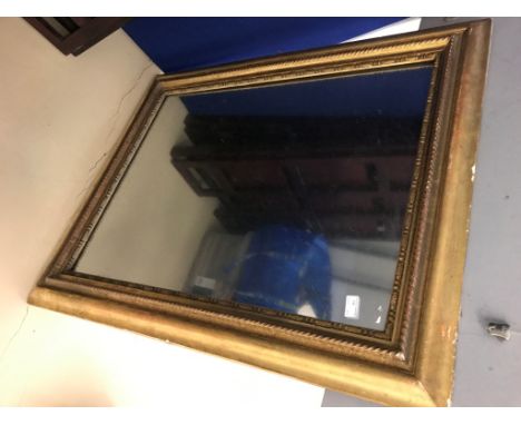 A large gilt framed mirror