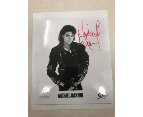 A Michael Jackson promotional photograph signed in red marker given to Reg Moule, his driver, while in London